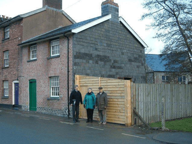 February 2005: External works completed. Alison with architect Charles Cowan and builder Graham Jones.